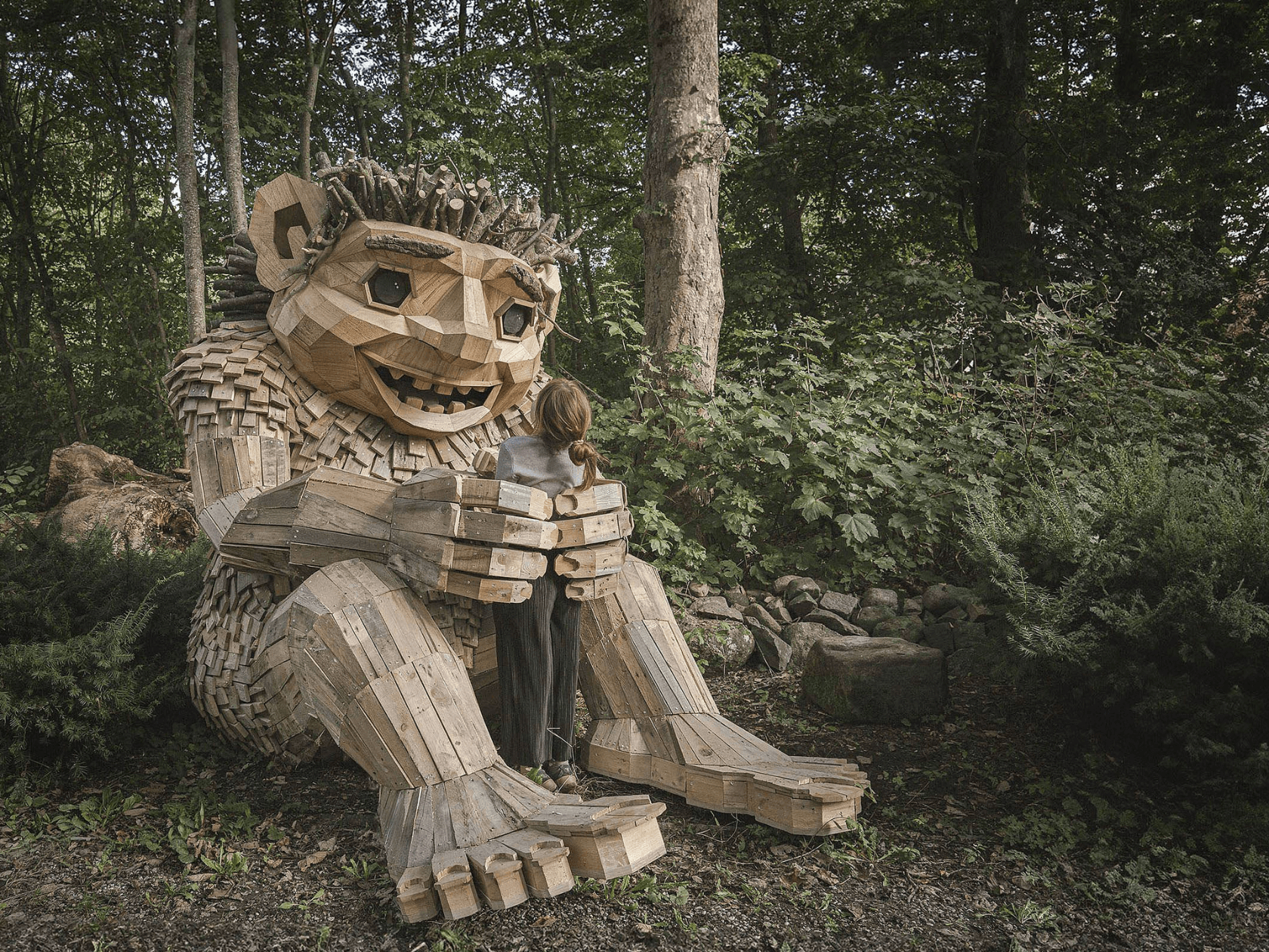 A handmade wooden statue of a woodland troll 